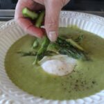 Creamy asparagus soup with poached eggs