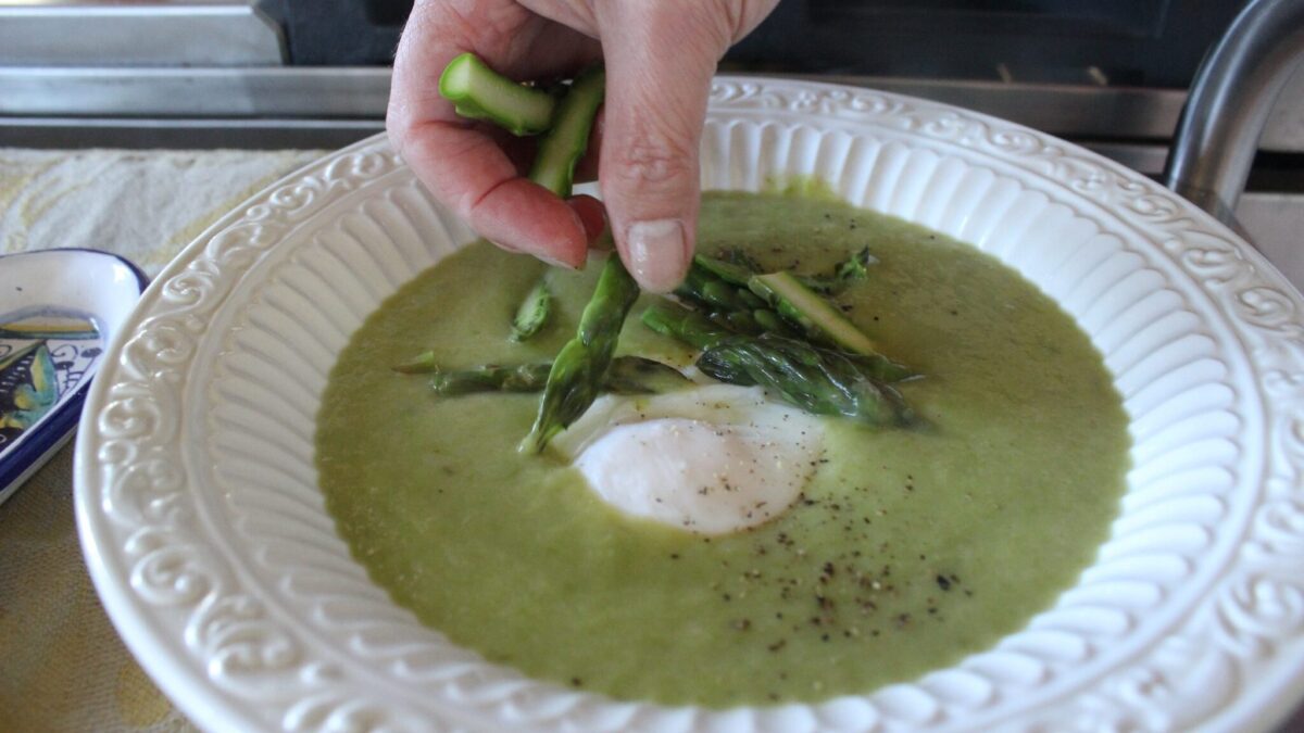 Creamy asparagus soup with poached eggs
