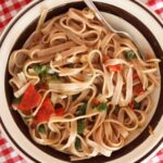 Green onion and tomato fettuccine, made with a touch of peperoncino. A few anchovy fillets give it a hidden, magical flavor