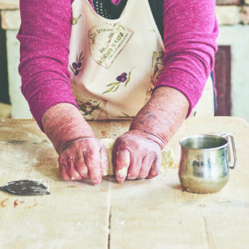 Because kitchens are so small most Italian women have a rough-and-tumble weathered pasta board that they keep in a closet and then pull out when it's time to make pasta