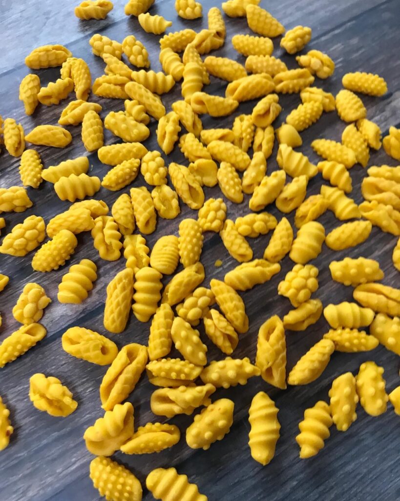 Pasta shapes rolled on boards for texture